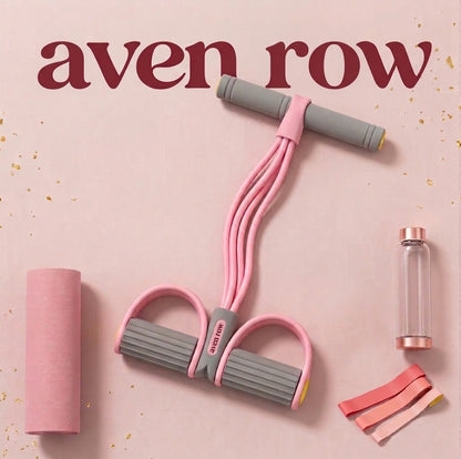 The Flow Band in Pink with gray cushioned grips and foot pedals, styled with workout accessories.